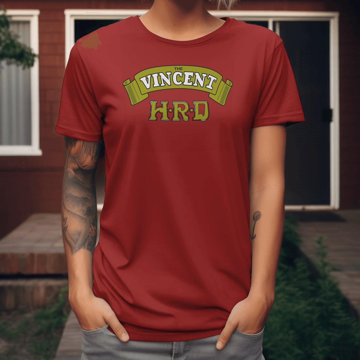 A black premium t-shirt featuring a vintage yellow scroll logo with "THE VINCENT