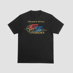 A black premium t-shirt featuring the text "#Explore Africa" in gold, a compass rose, and the BMW R1200 GS Adventure logo in red, blue, and gold.