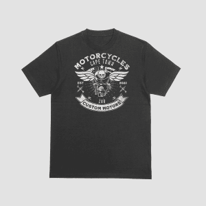 A charcoal black t-shirt featuring a white distressed circular graphic with a winged skull, motorcycle engine, and text that reads "Cape Town Custom Motors" ZAR.