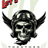 A navy blue t-shirt displaying a bold graphic of a skull wearing a vintage aviator helmet with goggles and wings. The text "Let's FLY" is printed in large white and red letters above the skull, with "TOGETHER" and small wing icons printed below it.